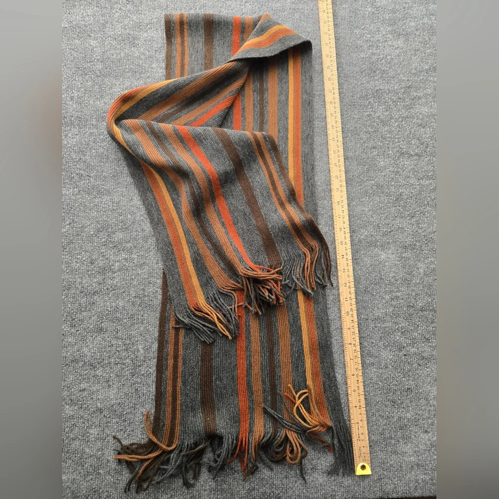 Womens Scarf featuring multicolor stripes and fringe ends. Perfect Pop Of Color‎